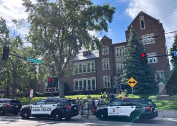 Police and first responders work at the scene of a shooting near Annunciation Church and Catholic School in Minneapolis, Minneosta, on August 27, 2025. US police responded Wednesday morning to a shooting at a Catholic school in Minneapolis, with officials saying that the shooter had been "contained." Local media, citing police sources, reported that the shooter was dead. (Photo by Tom BAKER / AFP)