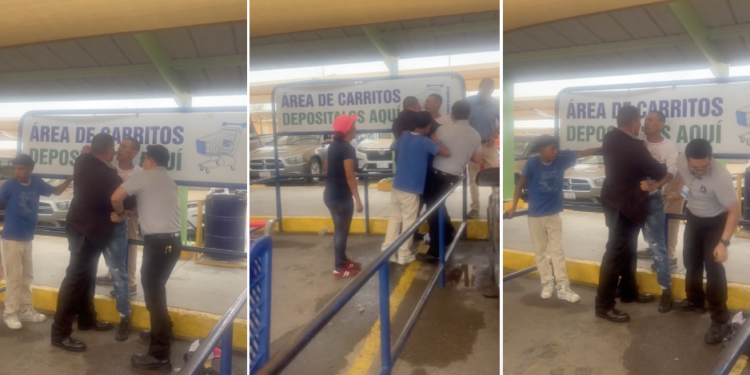 Momento en que personal del Centro Comercial Gutiérrez retiene al vendedor ambulante.